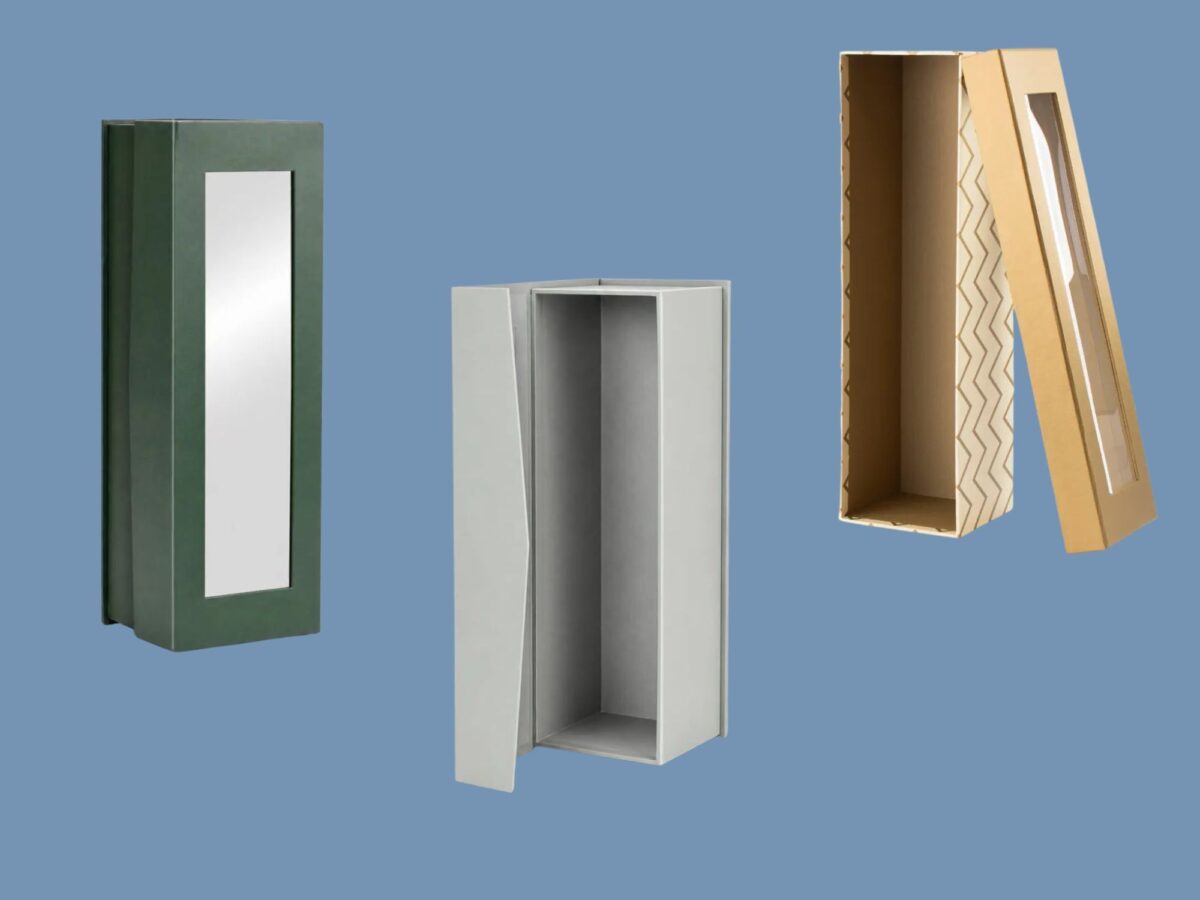 Selection of cardboard bottle packaging on a blue background