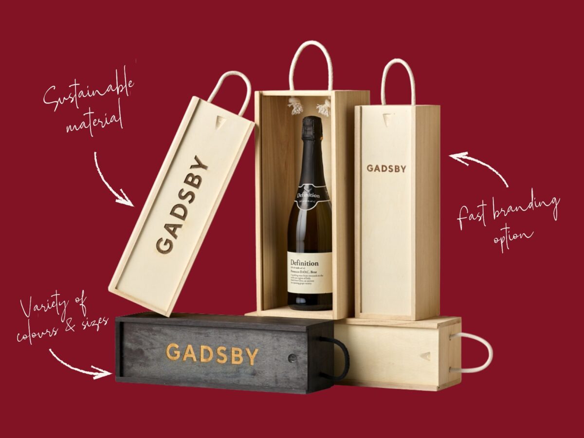 Selection of wooden bottle boxes on a deep festive red background with key highlights listed like sustainable material, fast branding option and colour and sizes variety.