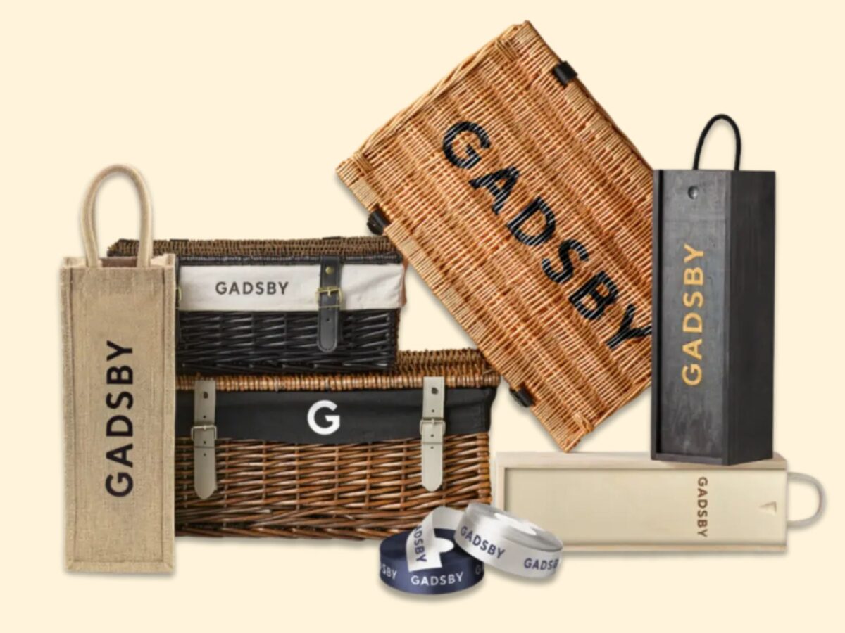 Selection of wicker hampers, jute bottle bags and wooden bottle boxes ideal for branding for businesses.