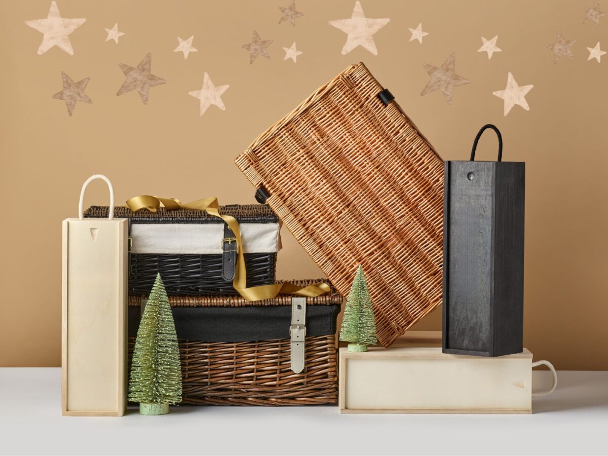 Arrangement of different hampers in a variety of materials including wicker hamper baskets and wooden bottle boxes