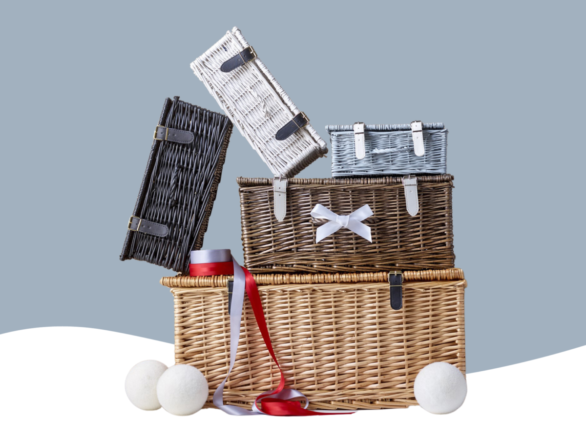 A selection of coloured wicker hamper baskets stacked randomly on top of each other