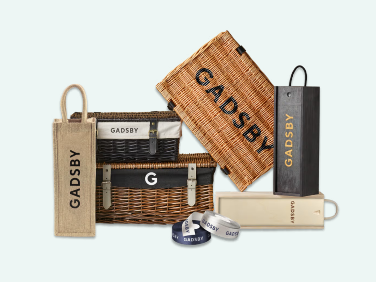 Corporate gifting for 2025 which includes wicker hamper basket stencilling, liner printing and branded ribbon