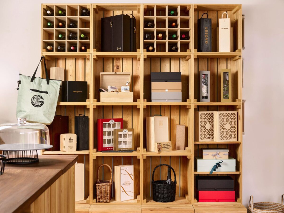 Rustic retail set up with a selection of hampers, bottle boxes and other POS items