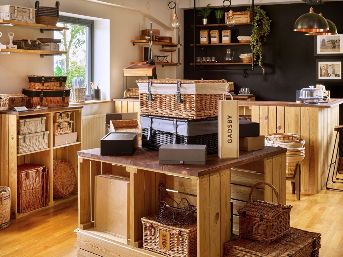 Rustic retail set up with a selection of hampers, bottle boxes and more