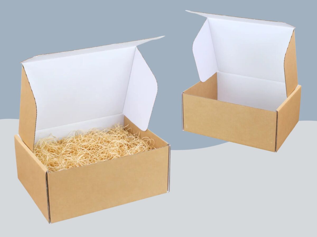 Selection of ecommerce boxes, one shown as empty and the other with some wood wool filling in it