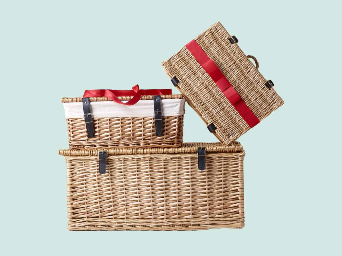 A stack of hampers in various sizes wrapped in red ribbon, perfect for making a Father's Day gifting range