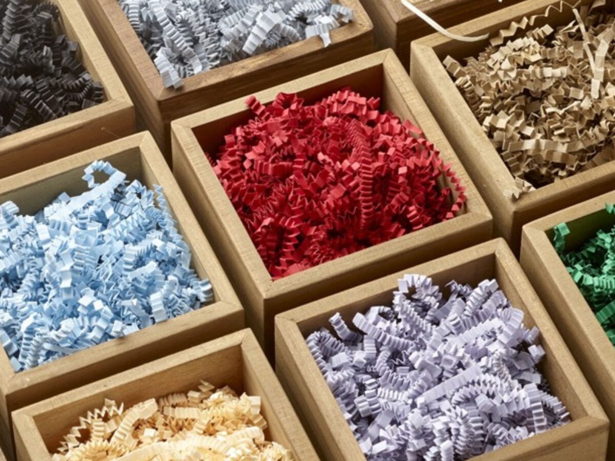 Shredded paper is a great hamper finishing touch, colours include red, blue, lilac, black and more