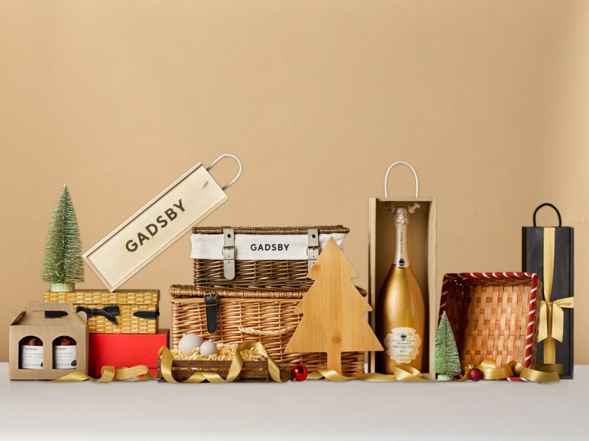 Selection of wicker hampers, cardboard hampers, cardboard trays, wooden bottle boxes and other gift packaging.