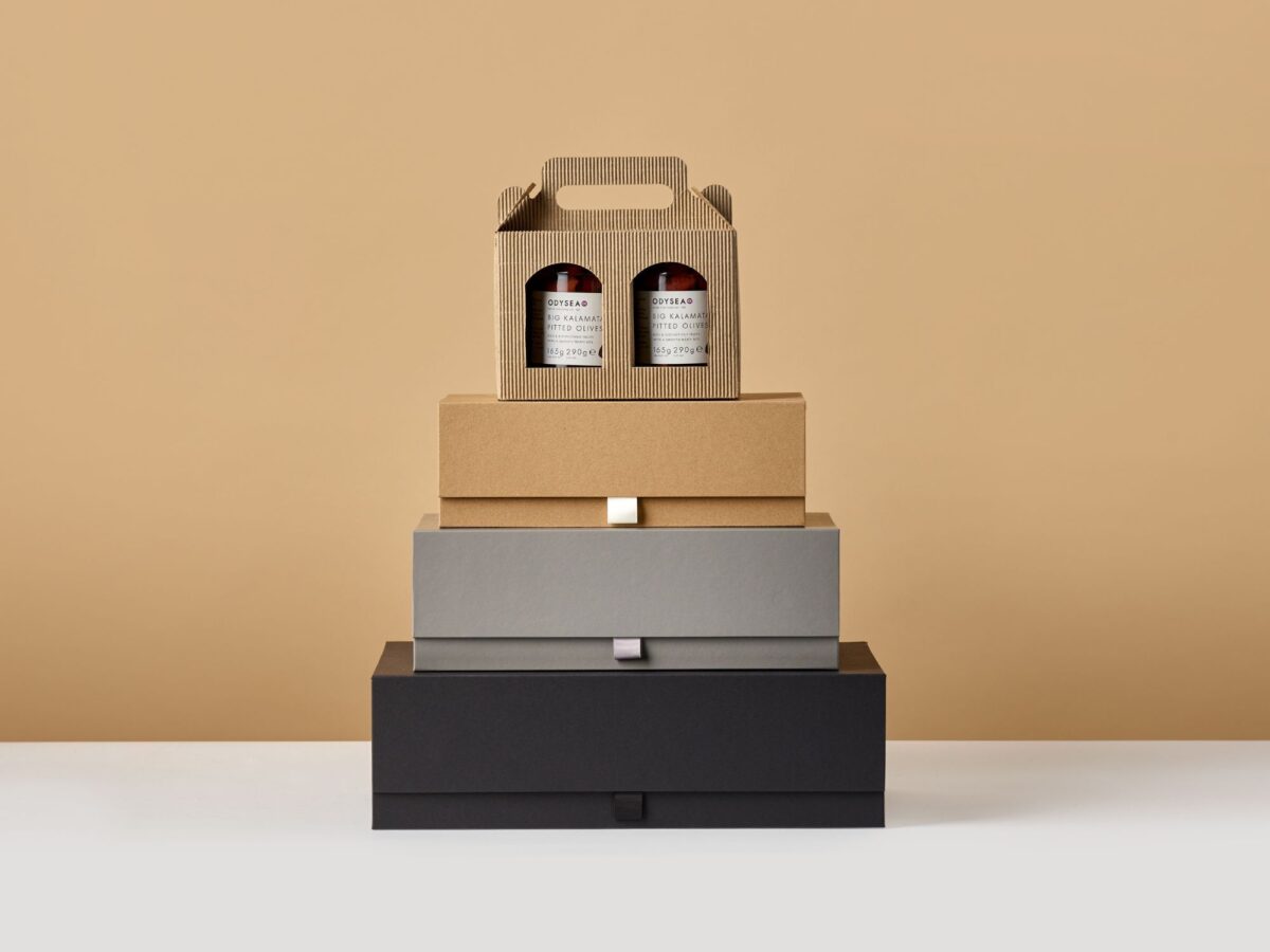 Stacked selection of card gift boxes with a jar box on top