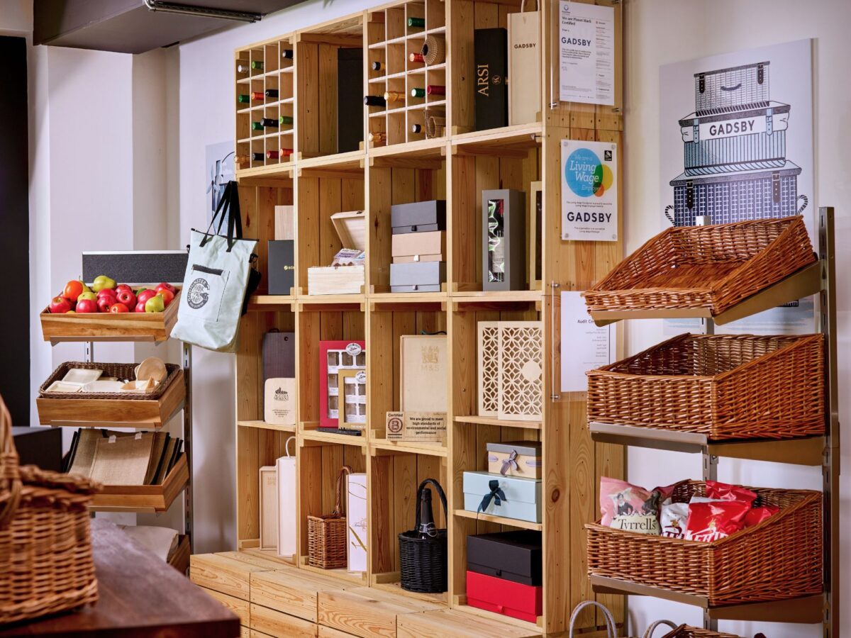 A retail space with CrateWall wooden shelving units and metal display stands.