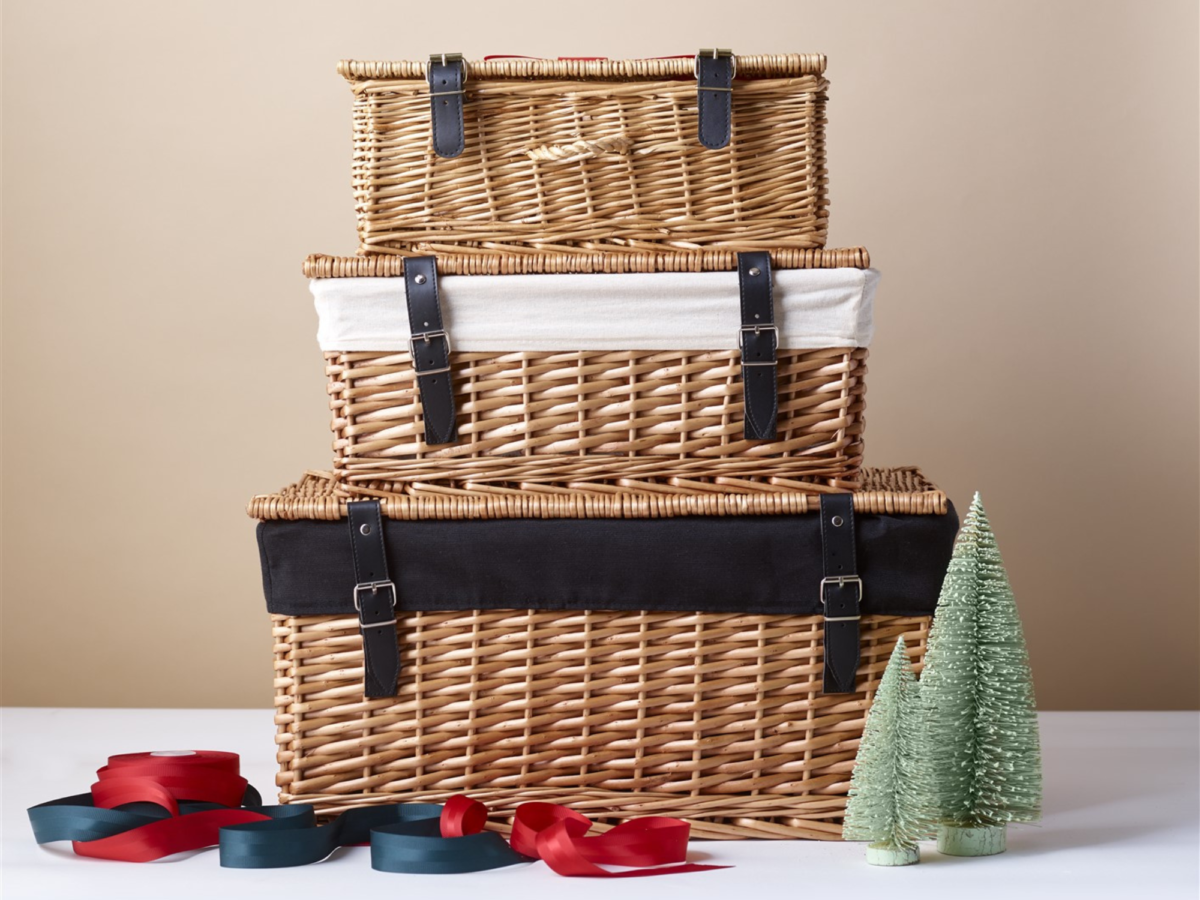Three hampers in a pile getting smaller and smaller on a plain background