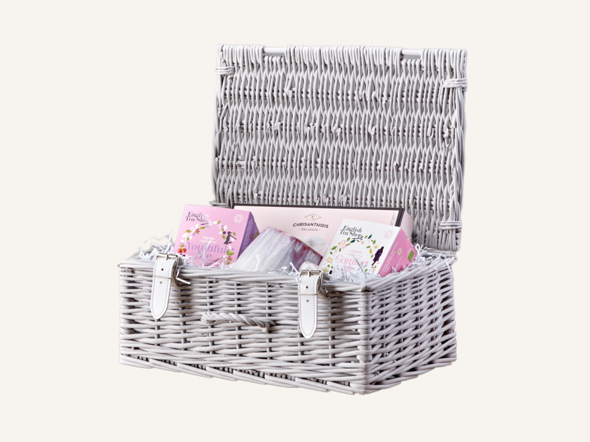 Small light grey hamper filled with skincare products