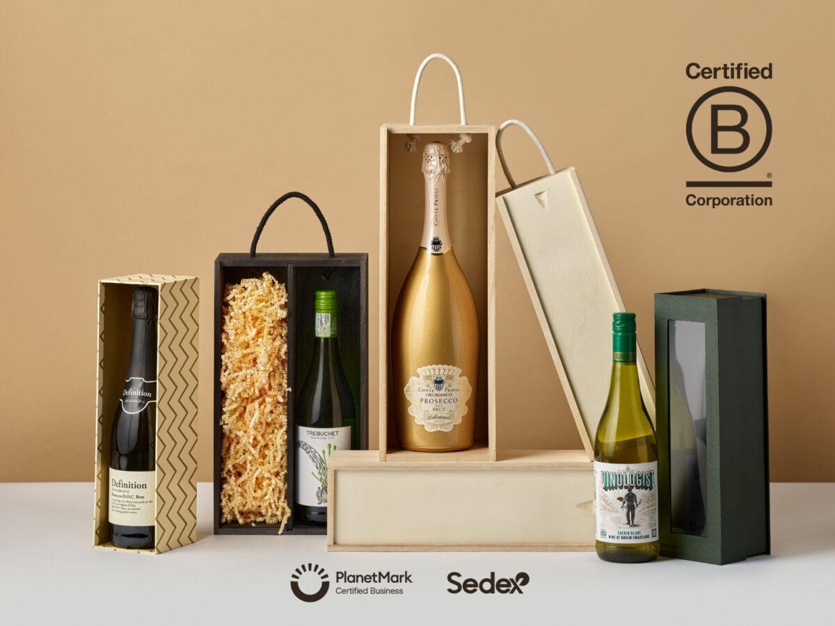 Sustainable packaging in 2026 includes wicker hampers, wooden bottle boxes, and cardboard boxes