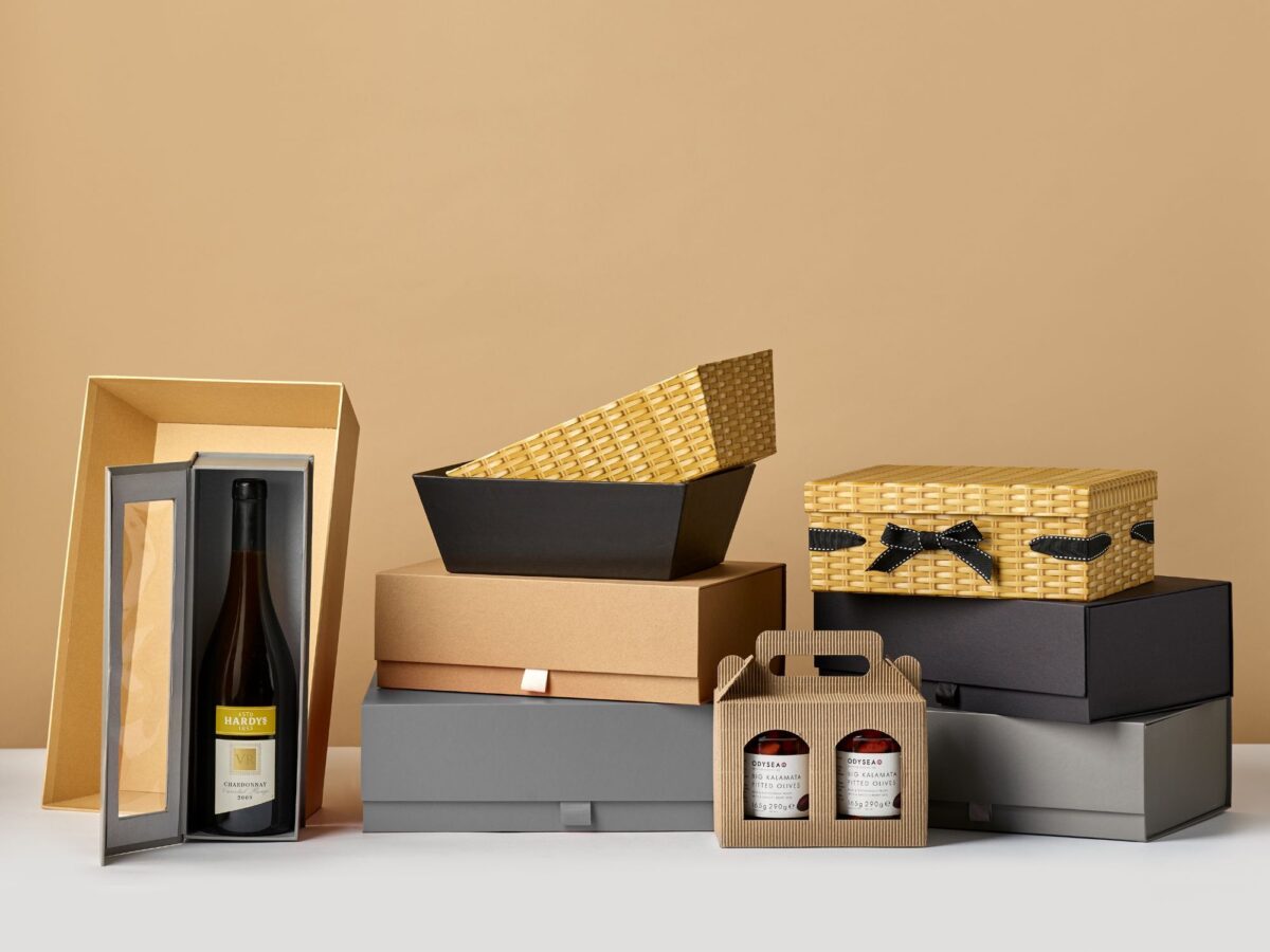 Selection of wicker hamper alternatives including wooden bottle boxes and card gift boxes and trays