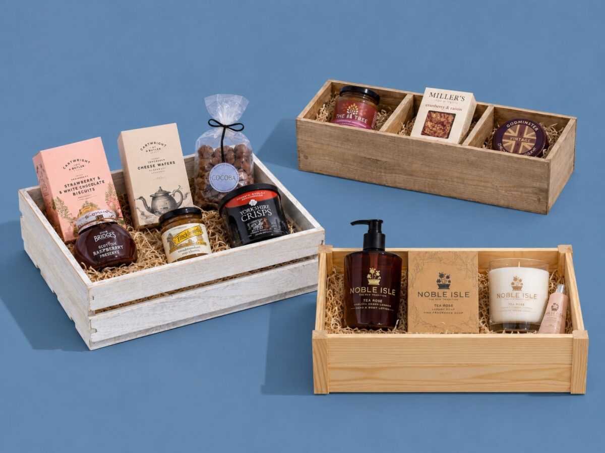 Selection of wooden crates in white, burnt wood, and other colours and a variety of sizes