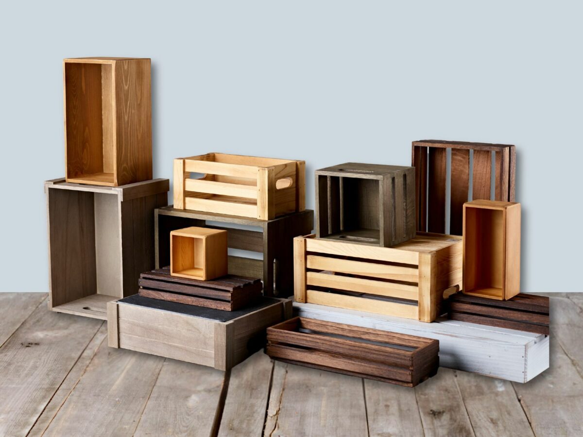 Selection of different wooden hamper crates on a blue background
