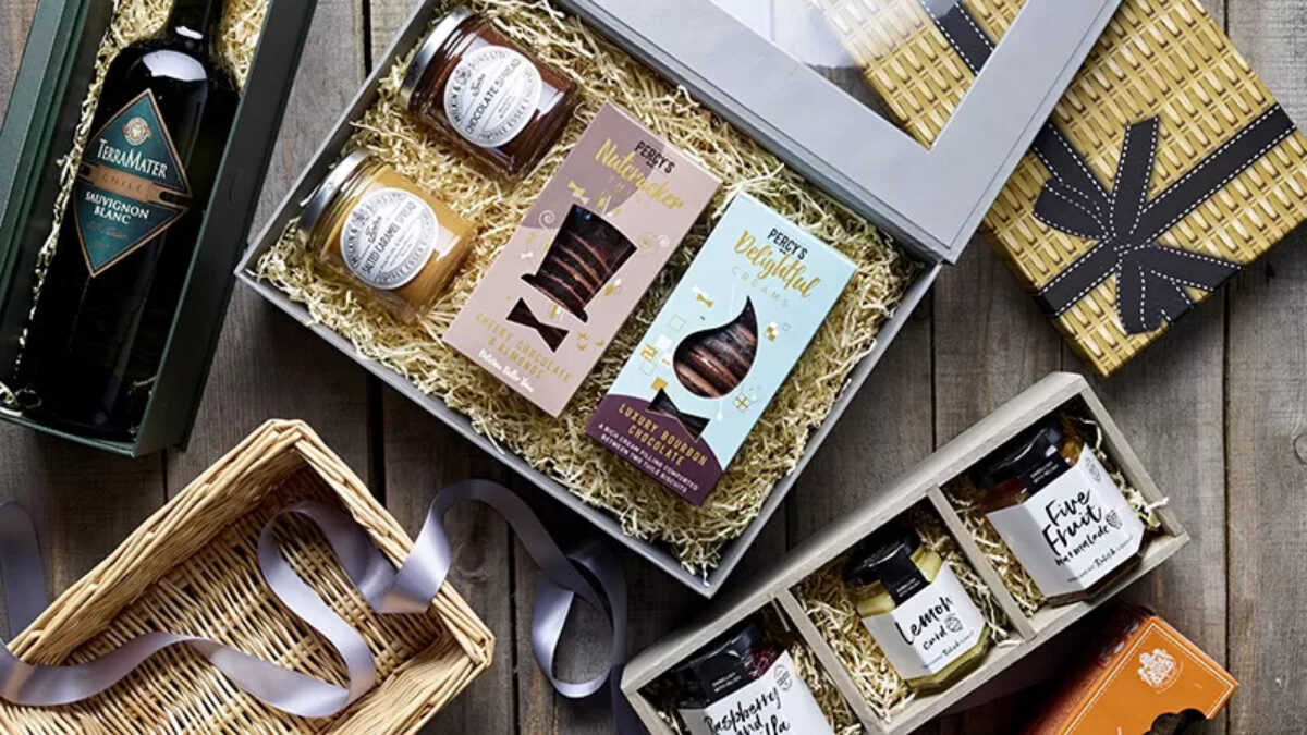 Open hamper with shredded paper and food products